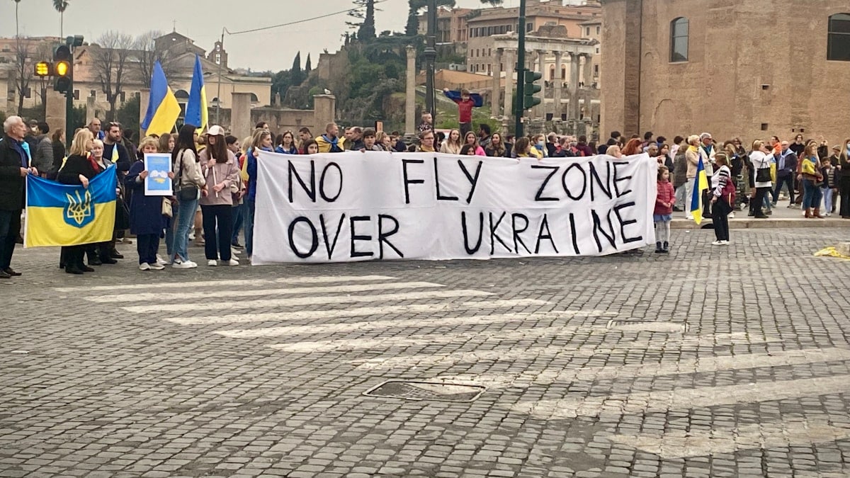 a group of people holding a sign